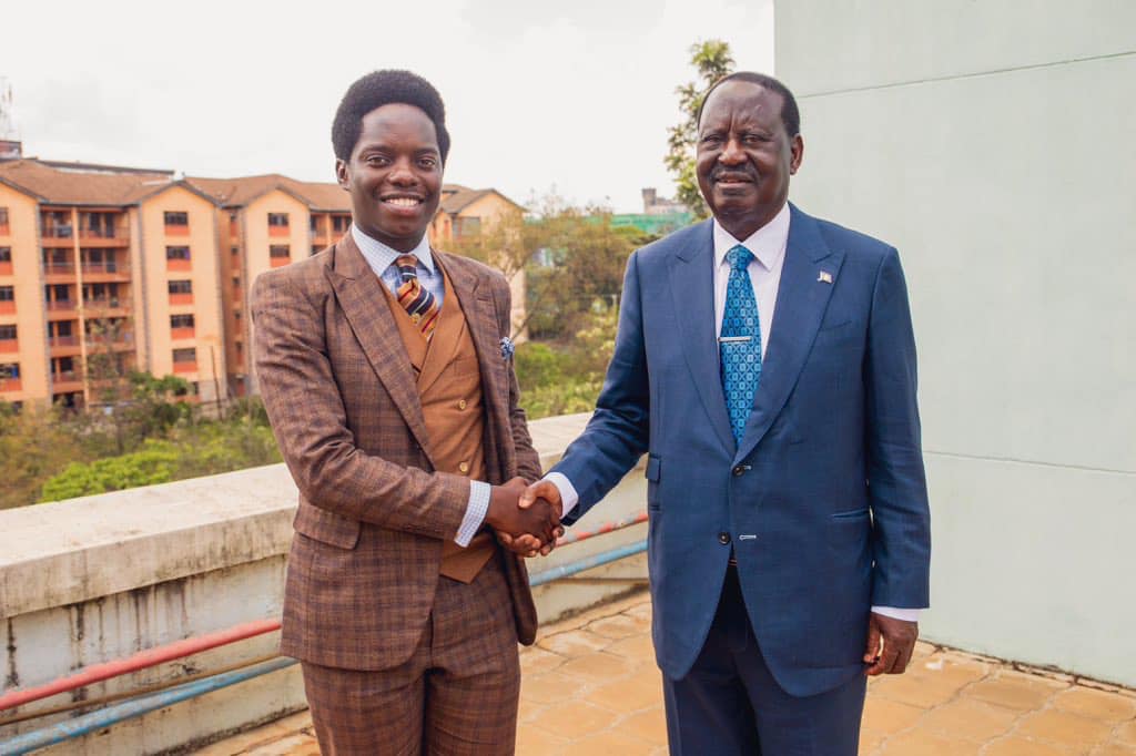 Activist Kasmuel McOure with the late Raila Odinga during a past event. Photo: Courtesy